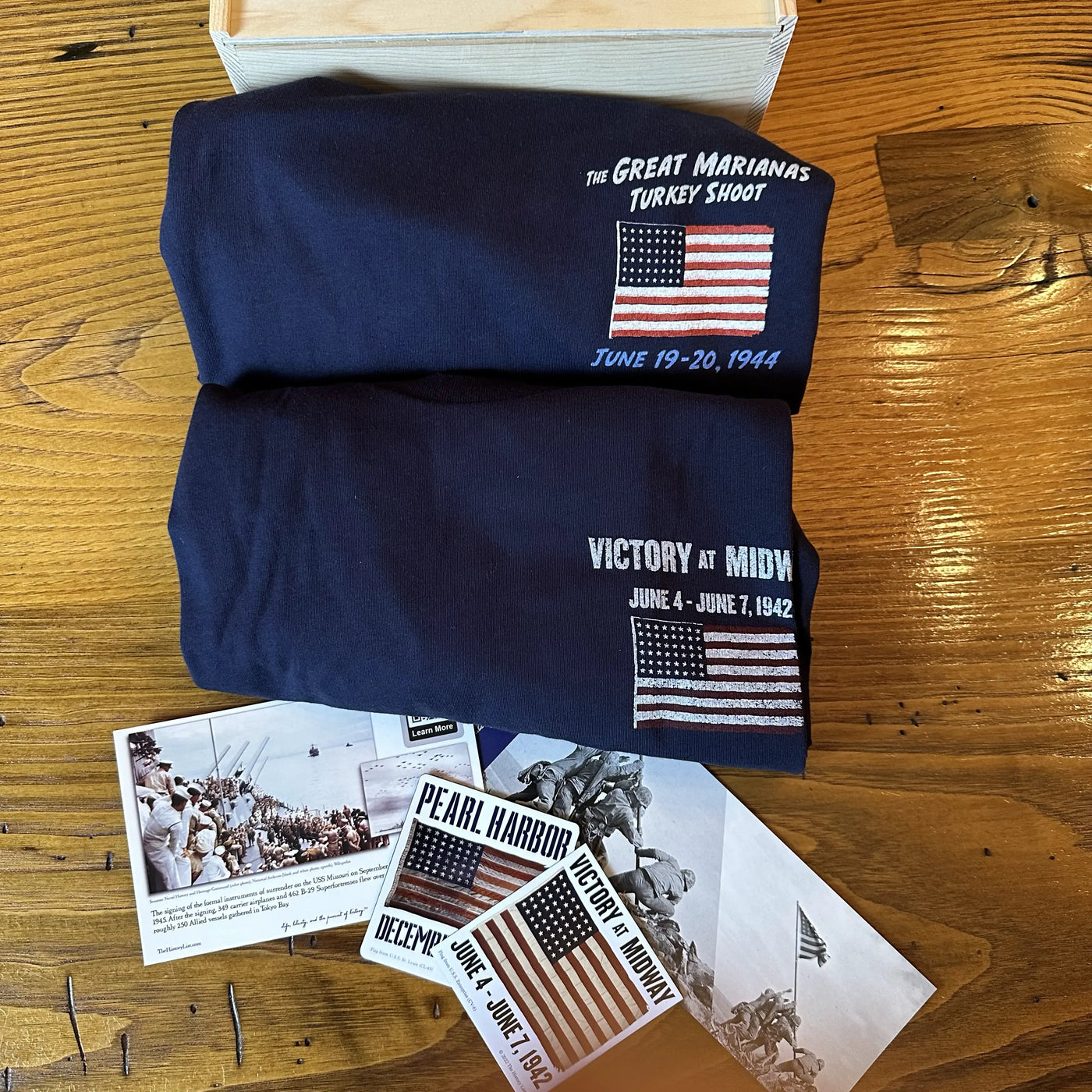 WWII Victory in the Pacific Gift Box with "Victory at Midway" Shirt and "The Great Marianas Turkey Shoot" Shirt along with stickers and bookmarks